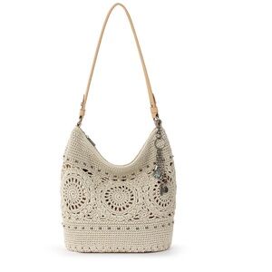 The Sak Crochet Hobo Bag in Cream with Charm Accents